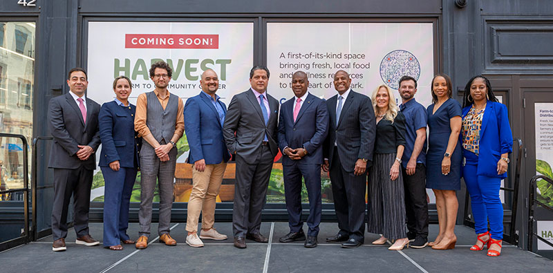 Harvest Farm to Community Center building exterior with RWJBH Leadership Team